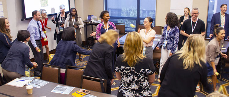 Workshop attendees participate in an interacvtive group exercise